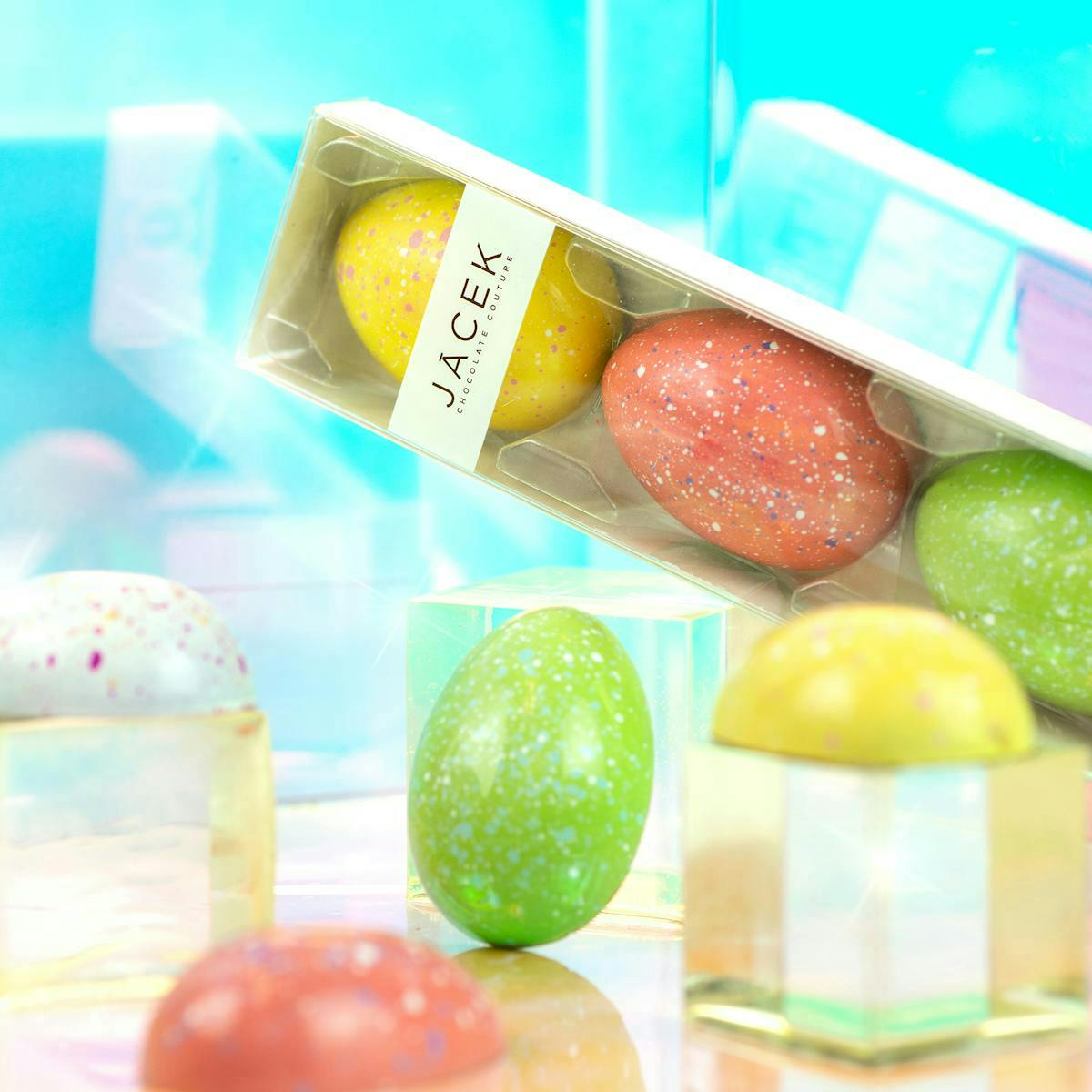Colourful chocoalte eggs in a package with the label Jacek.