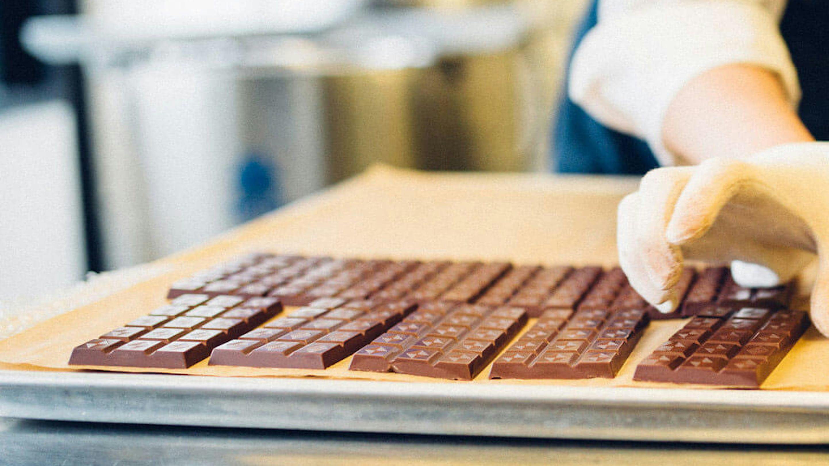 gently placing canadian artisan chocolate on tray