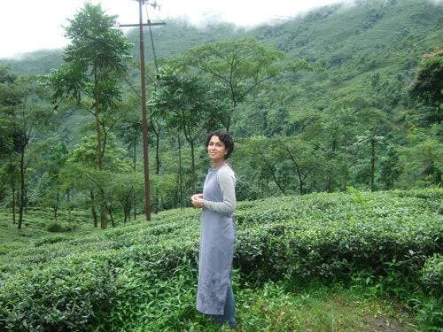 Hoda from Sloane Tea in the fields of a tea garden