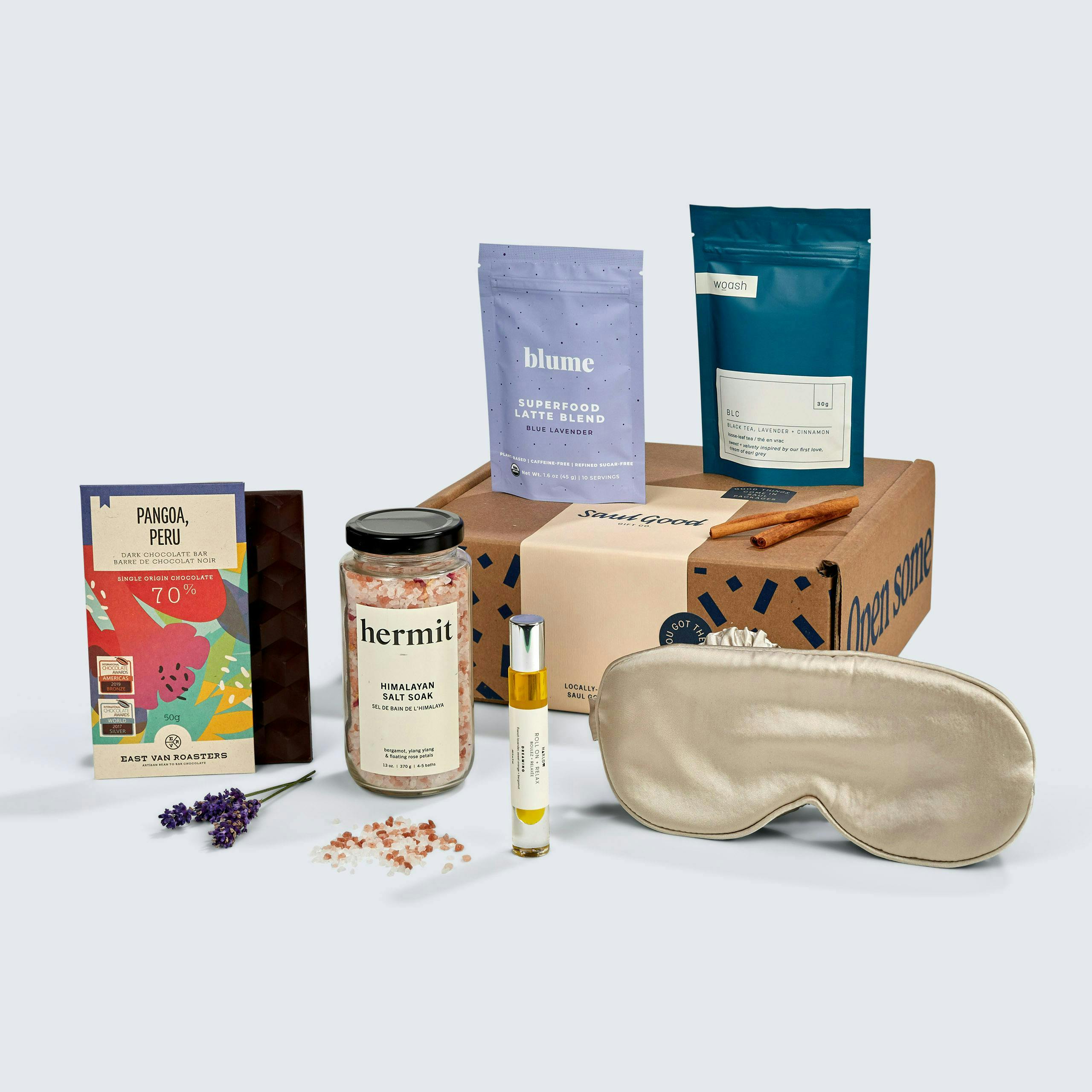Gift featuring of spa items: eye mask, chocolate, tea, bath salts, essential oils