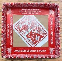 Image of customized chinese new year gift packaging with red designs.